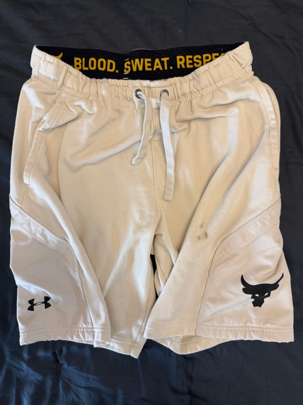 Under Armour Project Rock Men’s Cream Athletic Shorts with Black Logos
